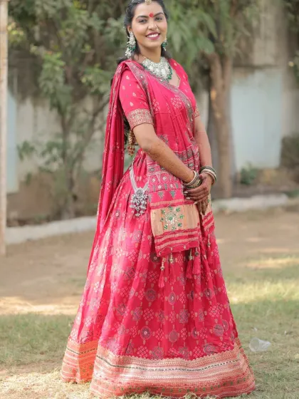 A full-length view of the bride's stunning pink lehenga for her Lagan Lekhan. The makeup and hair are styled to perfection.