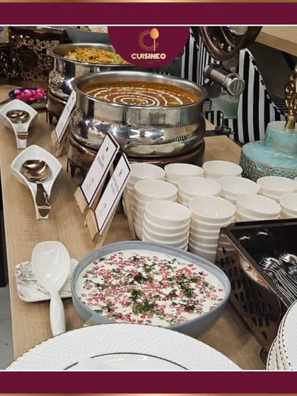 A classic Indian buffet setup featuring our signature Dal Makhani and Boondi Raita. We ensure our traditional dishes are presented with the same elegance and attention to detail as our international cuisine.