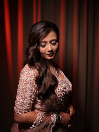 Another stunning shot of the reception look. The romantic curls and soft makeup create a look that is both elegant and modern.