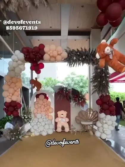 This is a modern take on the teddy bear theme for a baby shower. I used a sophisticated color palette of maroon, peach, and white, with dried pampas grass for a bohemian touch.