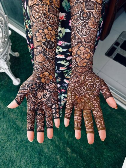 The palms of this design feature a beautiful mix of florals and traditional patterns, with a space for a personalized name or initial.