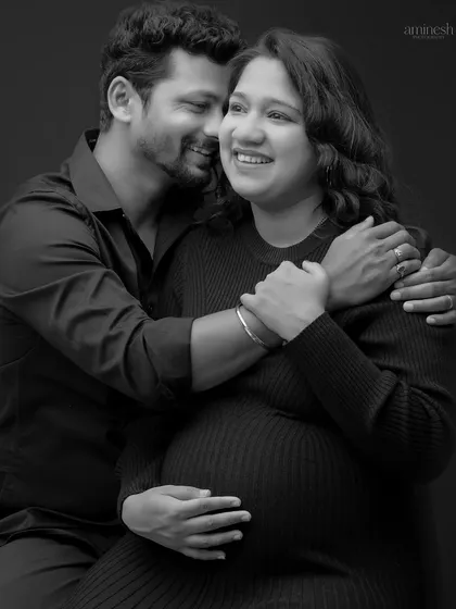 Laughter and joy are a huge part of the journey. This black and white photo captures a genuine, happy moment between the couple, creating a memory filled with warmth.