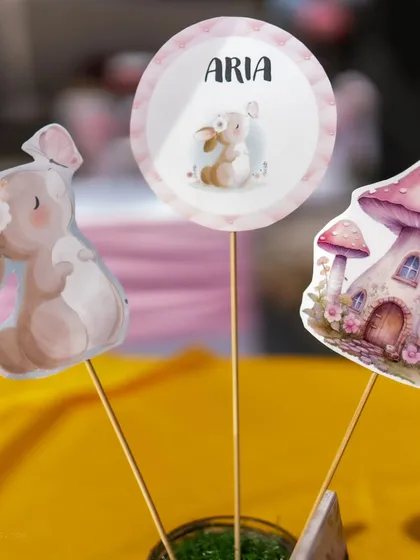 Adorable custom toppers for a rabbit-themed Mundan celebration. The toppers feature cute bunnies and a mushroom house, perfectly matching the pastel, storybook vibe.