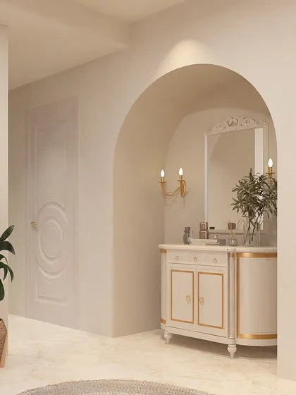 An arched entryway leads to this elegant powder room vanity. The classic design of the vanity, paired with candle-style sconces and marble flooring, creates a warm and welcoming first impression for guests.