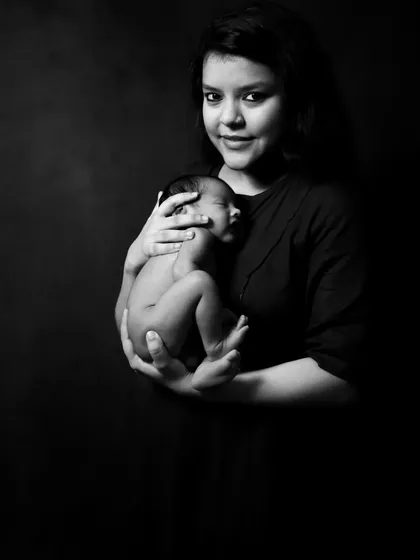 The purest love between a mother and her child. This dramatic black and white image highlights the beautiful bond and the delicate size of a newborn.