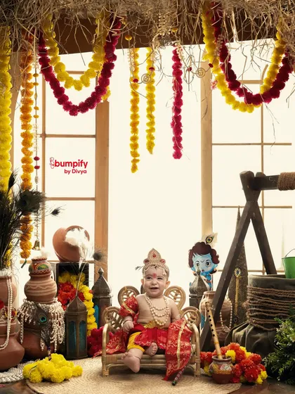 Our little Krishna has arrived! This baby boy looks adorable on his throne in our vibrant Janmashtami studio setup, ready to steal hearts.