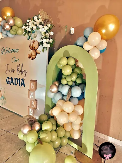 The balloon cascade inside the green arch, showing a mix of different sizes and colors to create texture and visual interest.