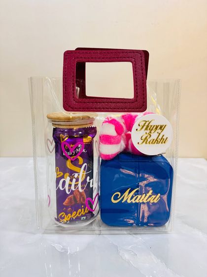 Another view of the Rakhi hamper for a sister, showing the personalized jewelry box and custom glass tumbler. It's a thoughtful and useful gift she will love.