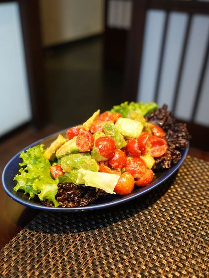 A vibrant Avocado and Tomato Salad, tossed in a Japanese-style dressing. This was part of our special Sakura menu, celebrating the fresh flavors of spring.