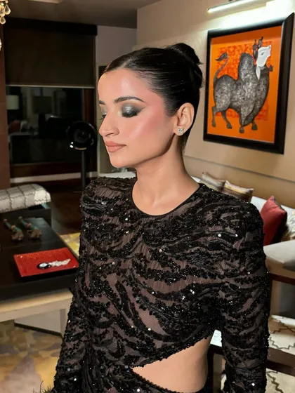 A close-up profile of the silver smokey eye. This angle shows the beautiful gradient of the eyeshadow and the clean, sculpted cheekbones.