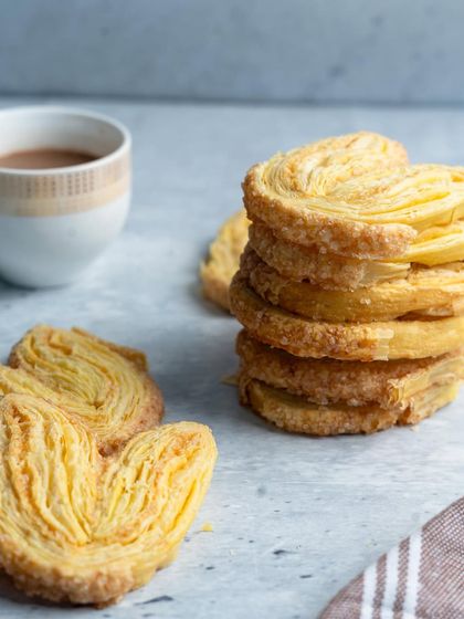 A stack of my flaky Palmiers, showcasing their beautiful layers. These light and sweet biscuits are a perfect, simple indulgence.