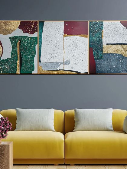 This triptych features a bold, geometric abstract design in green, red, and gold. The textured blocks of color create a modern and sophisticated look, perfect for a contemporary space.
