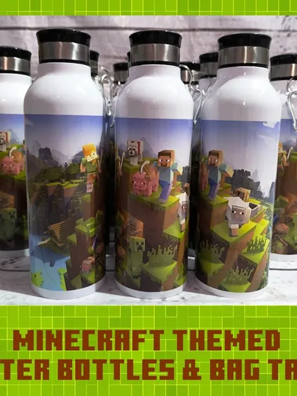 A batch of the Minecraft-themed water bottles, featuring the game's iconic blocky landscape and characters.