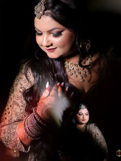 An artistic portrait of the bride from her engagement, with a creative smoke effect on her hand.