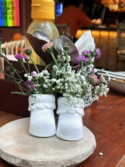 Another duplicate of the adorable baby sock centerpiece, a detail that guests are sure to remember.