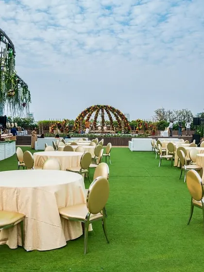 I excel at styling unique locations like this rooftop at Jade Gardens. The open-air setting with a domed floral structure creates a refreshing atmosphere for networking events or corporate celebrations, offering guests a memorable experience against the city skyline.