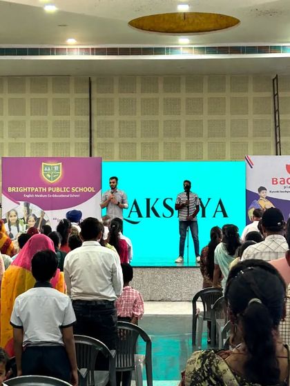 The word 'Lakshya' (Goal) displayed on the screen behind me. A major part of our seminars is helping students and parents set clear, achievable goals for their future.