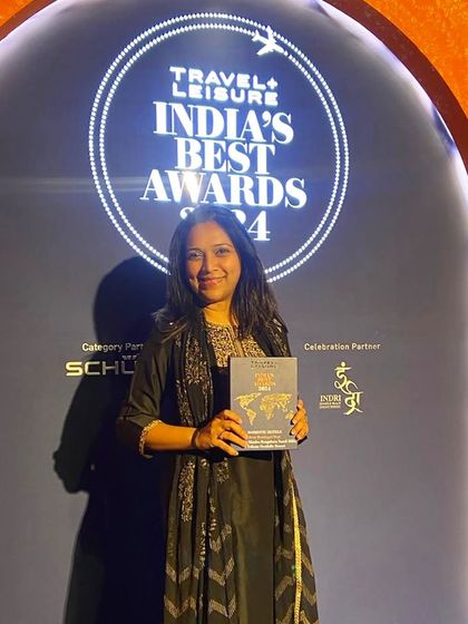 A member of our team proudly holds the award for Best Boutique Stay, a recognition of our commitment to excellence.