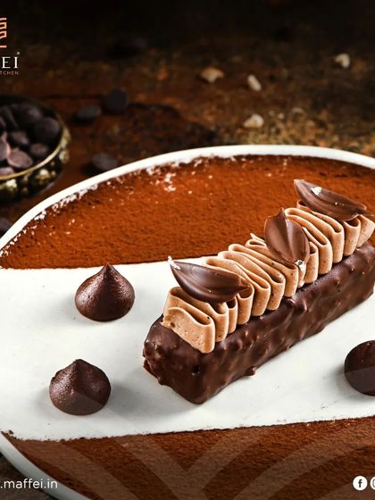 The Sachertorte, a classic Viennese chocolate cake. We make ours with rich, dark chocolate and apricot preserves, creating a dense and deeply satisfying dessert for chocolate lovers.