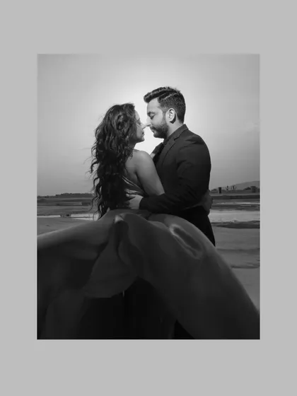 A black and white portrait from a pre-wedding shoot in Jaipur, capturing a moment of intimate connection with a dramatic, artistic flair.