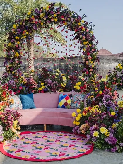 When a bride requested "no marigolds," we created this vibrant, blooming oasis for her Haldi. We used a riot of fresh spring florals, playful prints, and layered textures to design a modern and joyful setting that felt completely unique.