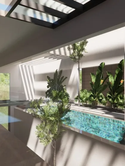 I believe nature shouldn't just be a view, it should be part of the home. Here, a lap pool is integrated into the core of the house, surrounded by indoor planters and lit by a large skylight, creating a private, tropical oasis.