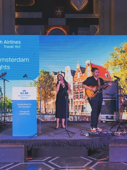 A shot of the full band on stage for a KLM Royal Dutch Airlines corporate event. This shows our professional setup for large-scale events, complete with custom branding. We ensure a polished, high-quality production every time.