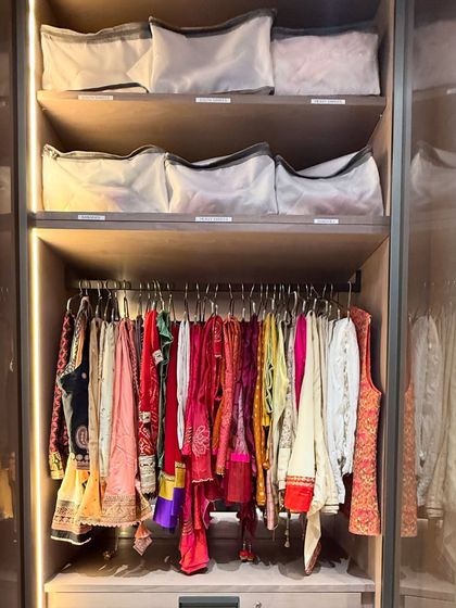 A dedicated section for festive blouses and lehengas. Hanging them allows the garments to breathe and prevents wrinkles, ensuring they are always ready to wear.
