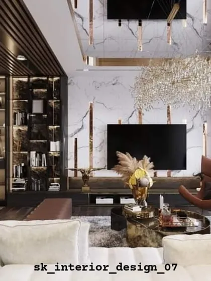A luxurious living room with a double-height ceiling and a dramatic TV wall. The design incorporates a fireplace, extensive shelving, and a stunning chandelier for a truly opulent feel.