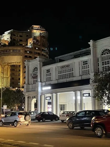 A night view of Connaught Place, showing the Statesman House and Oxford Bookstore. This area, the commercial heart of Lutyens' Delhi, has its own rich 20th-century history.