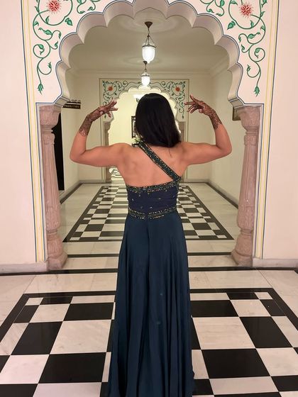 Who says you can't flex at a wedding? Showing off my back and bicep gains in a traditional Indian outfit. Strong is always in style.