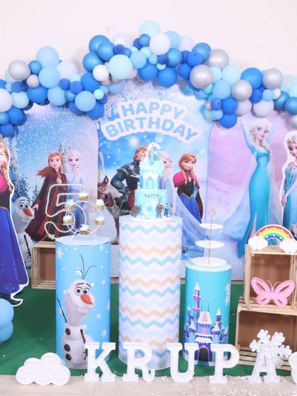 The Frozen cake displayed at the birthday party, showing how it fits perfectly with the decor.