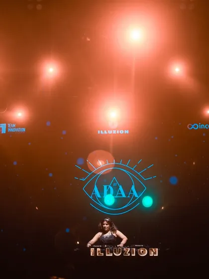 A wide shot showing the impressive stage lighting and my logo at Illuzion.