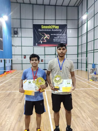 Our players Aryan and Vansh with their trophies from the Smash to Play Open tournament in Delhi. Aryan won gold in U-12, and Vansh secured silver in U-15.