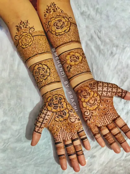 I love blending styles to create something unique. This Indo-Western design combines traditional check-patterns with bold, modern floral bands for a bride who wanted a contemporary yet intricate look.