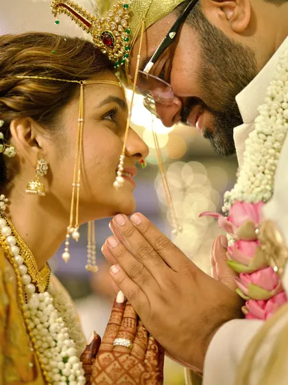 An intimate moment from a traditional Marathi wedding ceremony. We focus on the subtle glances and gentle touches that convey deep emotion, honoring the sacredness of every ritual.