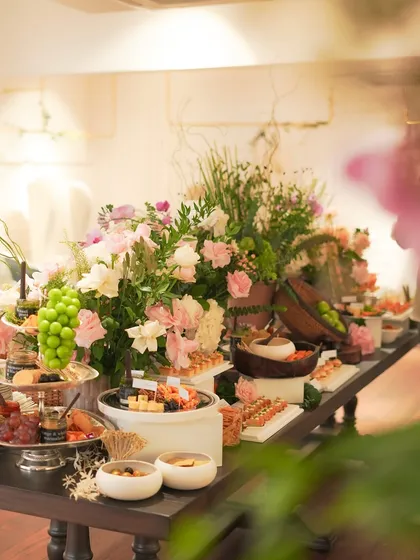 A stunning grazing table we created for a fashion launch in New Delhi. This bespoke spread for 200 guests features an abundant selection of artisanal cheeses, including local brie and burrata, paired with seasonal Kumaoni grapes, fresh fruits, house-made dips, and crisp crackers. The entire display is elevated with beautiful floral arrangements, creating a centerpiece that is both a feast for the eyes and the palate.