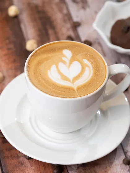 A perfect example of latte art created at our café. In the workshop, you'll learn the techniques to pour designs like this beautiful tulip.