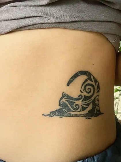 Here’s a healed shot of a custom cat tattoo done in my signature 'Masala Flow' style. You can see the bold, curvy, tribal-inspired linework that gives it a unique, flowing energy on the client's side. This is a great example of my desi-style tattoo art.