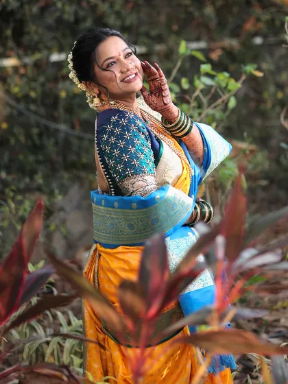 A joyful, candid shot of the bride. Her makeup is kept fresh and radiant, ensuring her happiness shines through as the main highlight of her look.