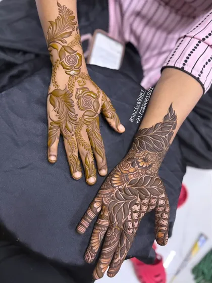 Here I've created two different but complementary styles for a client. One hand has a dense, leafy pattern while the other features a more delicate floral vine.