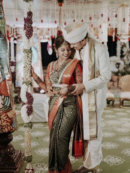 An intimate candid moment between the bride and groom during their wedding ceremony.