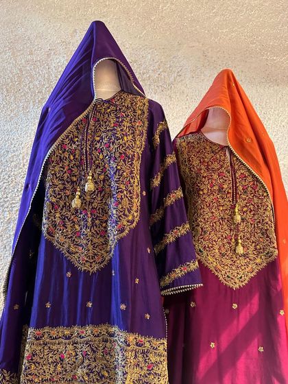 A close-up of the intricate zardozi and threadwork on the yokes of these majestic sharara sets, showcasing the depth of craftsmanship.