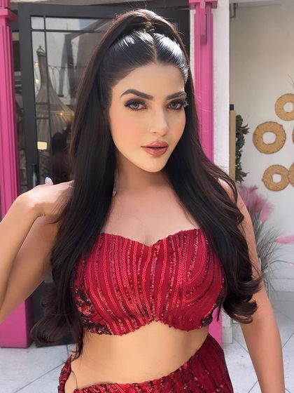 A snatched and sleek high ponytail is always a power move. This hairstyle is perfect for showing off a statement top and dramatic makeup.