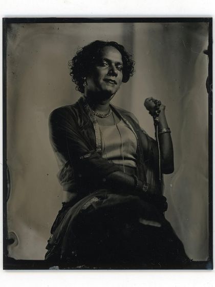 The subtle details in the fabric and the soft expression are rendered beautifully in this wet plate portrait. The process captures a depth and nuance that digital images often miss.