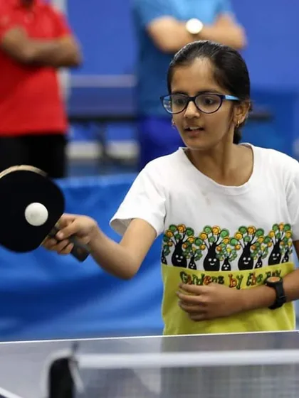 Nitya Madan prepares to hit a backhand shot. Her ready position and eye on the ball are perfect examples of the fundamentals we instill in all our players.