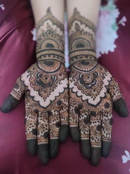 A classic Eid mehendi design with full coverage. The intricate mandalas and detailed finger work are perfect for celebrating.