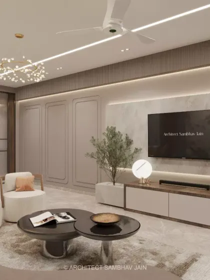 This living space is the epitome of modern luxury. We curated this room with neutral tones, textured finishes, and ambient lighting to create a seamless blend of sophistication and warmth. The bespoke paneling and sculptural furniture exude timeless elegance.