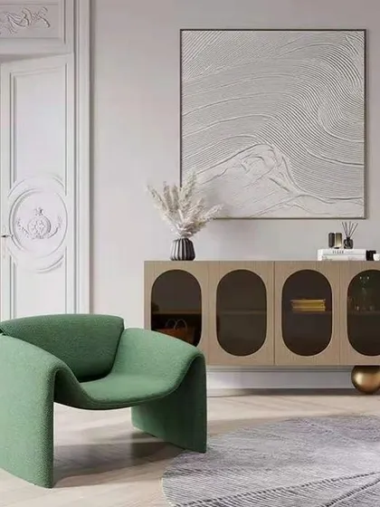 A duplicate image of the stunning green sculptural chair, a true work of functional art.