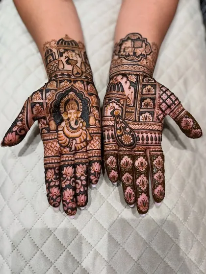 The beauty is in the details. This design features a finely detailed portrait of Lord Ganesha for blessings, surrounded by delicate lotus motifs and traditional Indian patterns.
